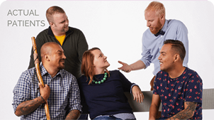 A group of five people having a conversation in front of a white background.